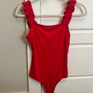 Red body suit with ruffle elastic strap detail